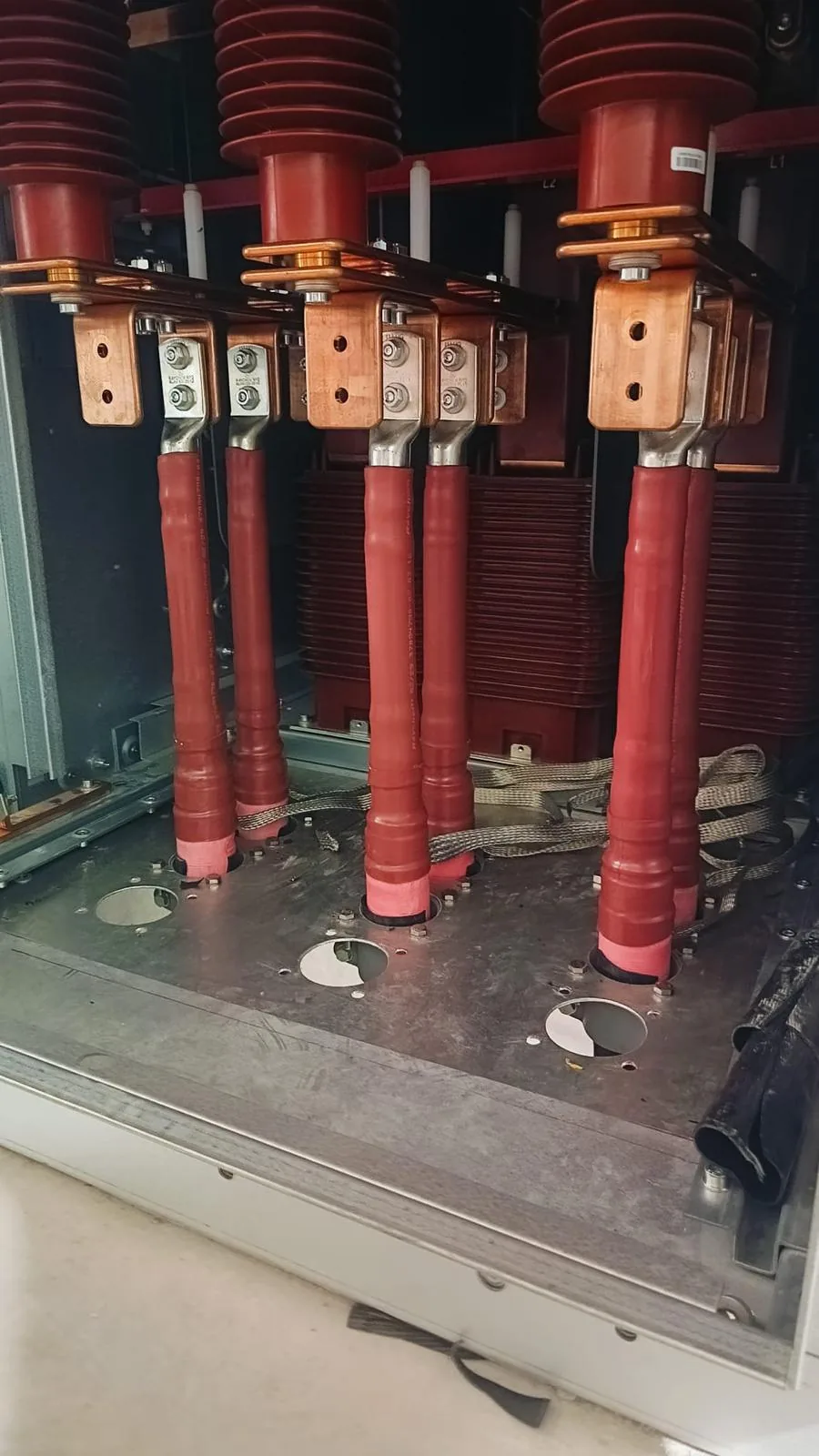 Heat-shrink HV cable termination being shrunk down with a gas torch on a Singapore industrial site